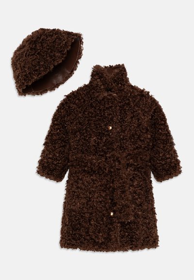 Brown, fuzzy coat made of textured fabric, featuring a high collar, short sleeves, and a matching cap with a smooth interior lining.
