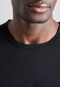 Black short-sleeve t-shirt with a round neckline, made of smooth fabric, featuring subtle stitching details along the collar.