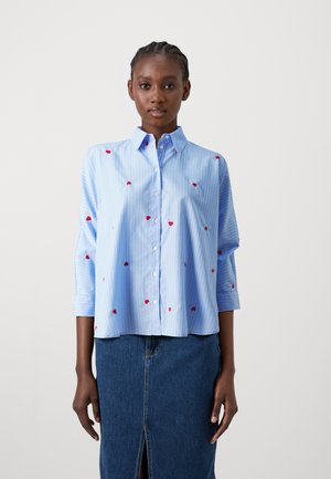 Light blue button-up shirt with vertical white stripes and red heart embroidery. Features a collar and three-quarter sleeves.