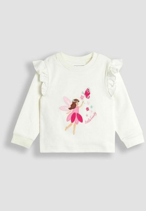 Valge dressipluus volangvarrukatega, millel on hõbedastes ja lavendlivärvi tikandites haldjate, liblikate ja lillede kujutised.