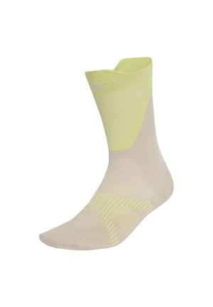 Chaussette beige clair avec des accents jaune pâle au talon, à l’orteil et au bord-côte, montrant un design à bord-côte plié sur fond blanc.