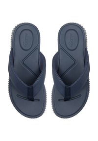 Marineblaue Flip-Flops mit strukturierten Riemen und strapazierfähigen Gummisohlen. Sie zeichnen sich durch ein modernes Design mit einem Zickzackmuster auf den Riemen aus.