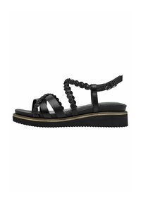 Sandaales negras con suela de plataforma, que presentan correas de cuero texturizado y un diseño trenzado en el tobillo. Correa ajustable con hebilla de metal.
