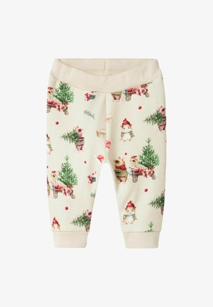 Bløde, cremefarvede sweatpants med et eventyrligt dyremønster, der viser festlige scenarier, ribbede manchetter og et komfortabelt waistband.
