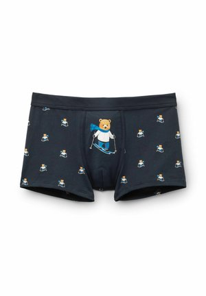 Boxershorts in donkerblauw Fabric, met een herhaald patroon van een skiën bear in een blauwe sjaal. Zacht, rekbaar materiaal met een elastische tailleband.