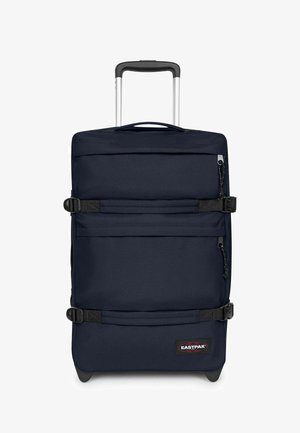 Valigia verticale blu navy con ruote, manico estensibile, due cinghie di compressione orizzontali, tasca frontale con zip e patch con logo Eastpak.