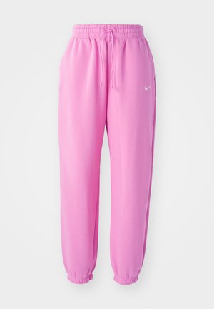 Rosa joggebukser med elastisk midjebånd og snøring. Mansjettene er samlet. Har en liten hvit Nike-logo på venstre lår.