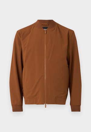 Rjava bomberska jakna iz gladkega materiala. Ima zadrgo, rebrast ovratnik, elastične manšete in dve stranski žep.