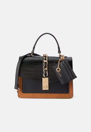Structured handbag with a black crocodile-textured top, tan bottom, gold chain accent, and a detachable cardholder. Smooth and sleek materials.