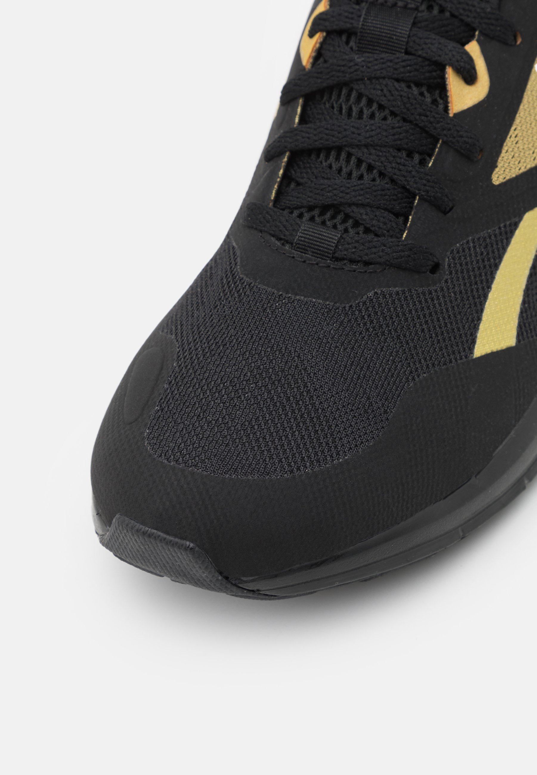 nike black and gold runners