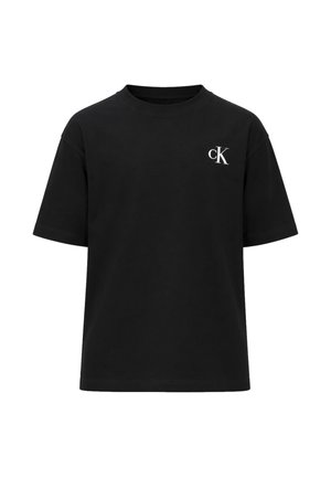 T-shirt nera a maniche corte con scollo rotondo e logo bianco "cK" sul petto sinistro.