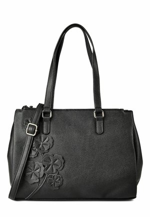 Sac à main en cuir noir avec deux bretelles d'épaule, une bandoulière ajustable et un motif floral embossé en bas à gauche.