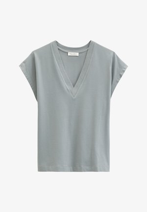 Light gray short-sleeve V-neck shirt with a loose fit and branded label inside the collar.