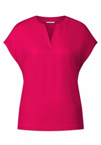 Blusa corta de manga corta en color fucsia con un diseño de escote en V. Tejido suave con un ajuste relajado. Presenta un dobladillo recto y sin patrones o acentos visibles.