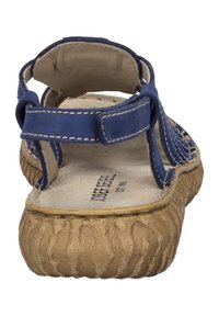 Navy blauwe leren sandaal met een gestructureerde kurken zool, verstelbare enkelband en een gevoerde voetbed met geperste branding.