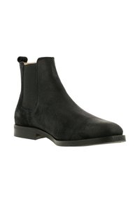 Sorte ruskinds Chelsea-boots med elastiske sider og strop, med en rund tå og flad gummisål.