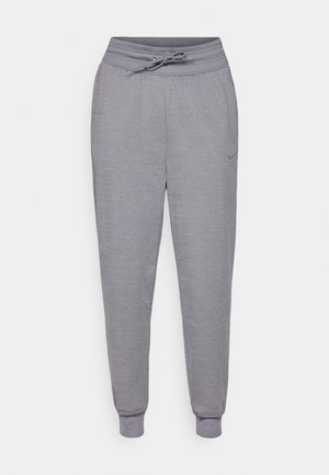Gray sweatpants made of soft fabric, featuring an elastic waistband with drawstring, ribbed cuffs, and a subtle logo detail on the side.