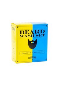 Skäggtvättsset i en box i blått och gult, med fet svart text. Inkluderar schampo och balsam; slät, rektangulär förpackning.