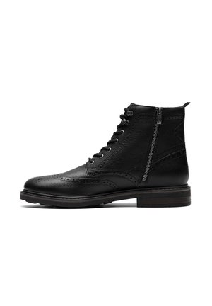 Black leather ankle boot with brogue detailing, lace-up front, side zipper, and a textured finish. Features a stacked wooden heel.