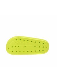 Soletta gialla brillante con una superficie testurizzata, caratterizzata da diversi fori di ventilazione e una forma sagomata per il supporto.
