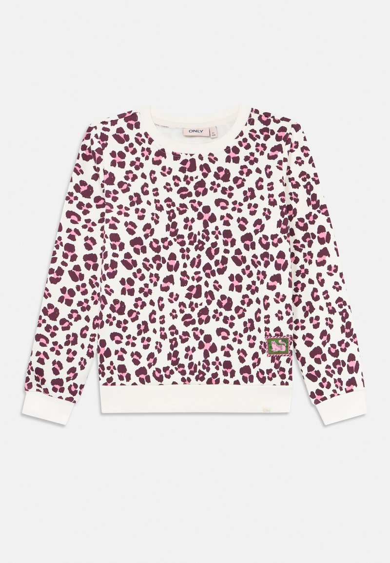 Langermet hvit genser med rosa og lilla leopardmønster og en liten rektangulær lapp nær kanten på høyre side.