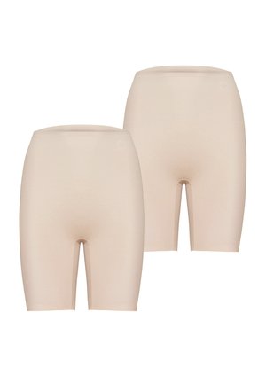 Beżowe elastyczne szorty o bezszwowej konstrukcji i elastycznym pasie, sięgające do połowy uda, o gładkiej, matowej fakturze.