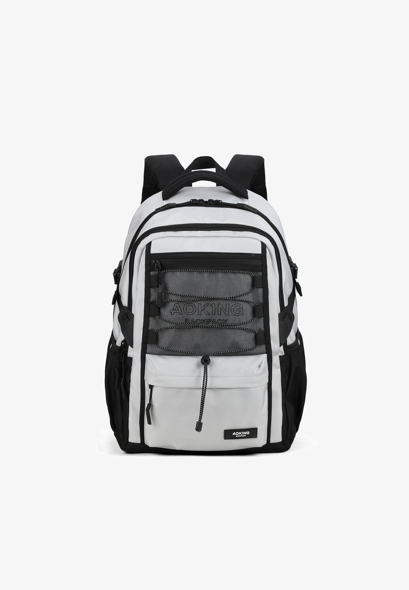 Zaino grigio e nero con molteplici tasche con cerniera, dettagli in rete, spallacci imbottiti e una maniglia superiore per il trasporto.