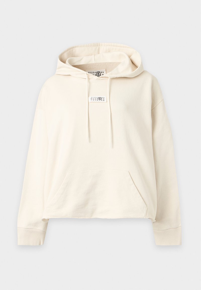 Sweat à capuche écru avec poche kangourou avant, cordon de serrage à la capuche, poignets côtelés et petite étiquette tissu sur la poitrine et à l'intérieur du col.