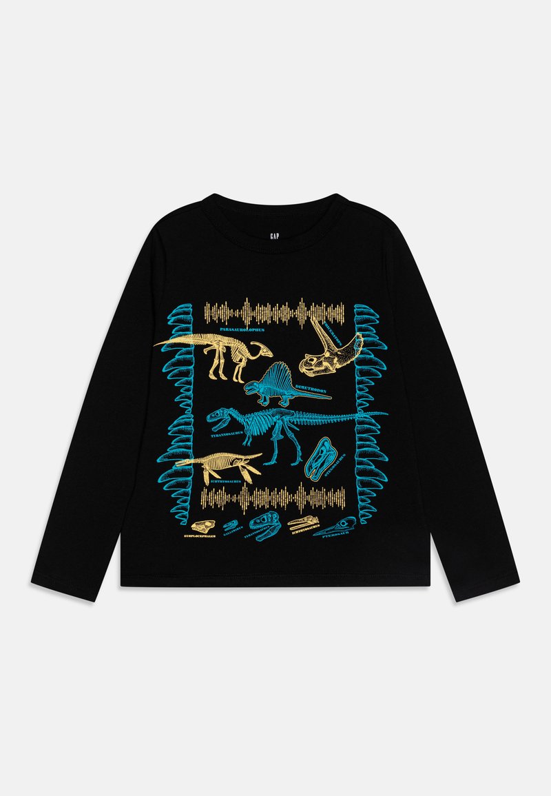Melna garām piedurknēm T-krekls ar spilgti ziliem un zelta dinozauru skeleta grafikas attēliem un skaņas viļņu rakstiem centrālajā dizainā.