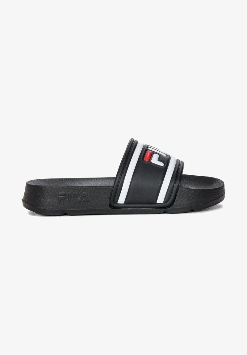 Black slide sandal with textured material. Features a wide top strap with white and red accents, and a flat sole. Fila logo on the side.