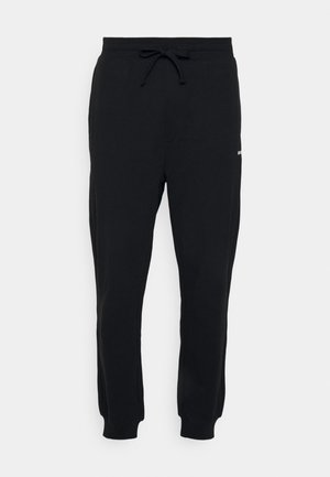 Svarta sweatpants i bomullsblandning, med elastisk midjeband och justerbar dragsko, ribbade mudd och en liten logotypdetalj.