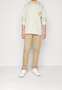 Tommy Jeans Mikina s kapucí - beige