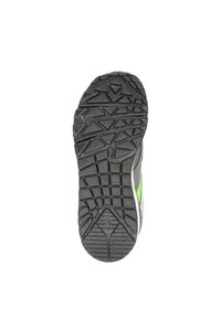 Shoe sole featuring a gray base with a textured black rubber tread and green accent. Tread pattern includes various geometric shapes for traction.