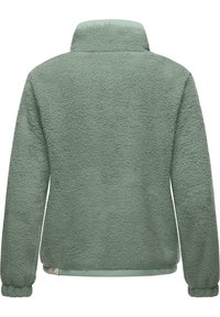 Green fleece jacket with a soft texture, high collar, and long sleeves. Features a smooth lower hem and branded tag at the bottom.