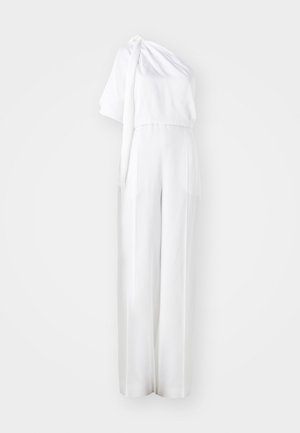 Hvid jumpsuit med én skulder, blødt tekstur, vidde ben og knyttet detalje ved skulderen.