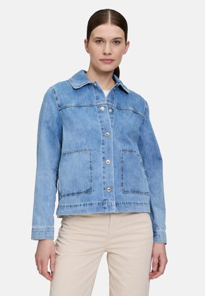 Light blue denim jacket with a button front, pointed collar, two large patch pockets, and contrasting stitching on sleeves and hem.