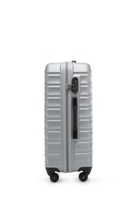 Silver hard-shell suitcase with a ribbed texture, dual zippers, a combination lock, and four smooth-rolling wheels for versatility.