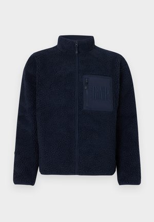 Marinblå fleecetröja med dragkedja och hög krage samt bröstficka med dragkedja och präglad GAP-logotyp.