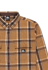Geruite flanellen shirt in het oranje, bruin en wit. Met een kraag, knoopsluiting en een borstzak met een logo-label. Zachte textuur.