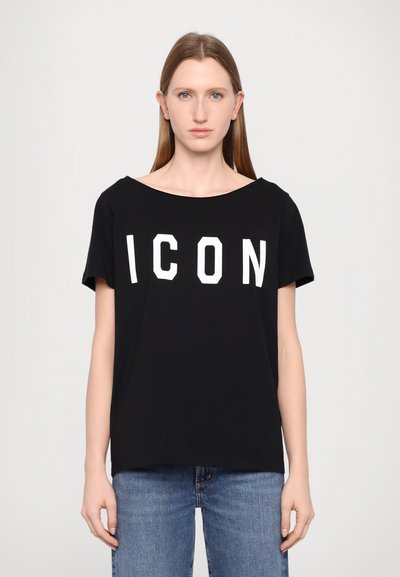 T-shirt noir à manches courtes avec un décolleté large, arborant l'inscription "ICON" en lettres blanches audacieuses sur le devant, fabriqué dans un tissu doux et lisse.