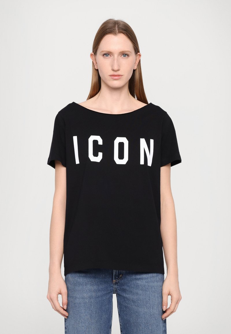 T-shirt noir à manches courtes avec un décolleté large, arborant l'inscription "ICON" en lettres blanches audacieuses sur le devant, fabriqué dans un tissu doux et lisse.