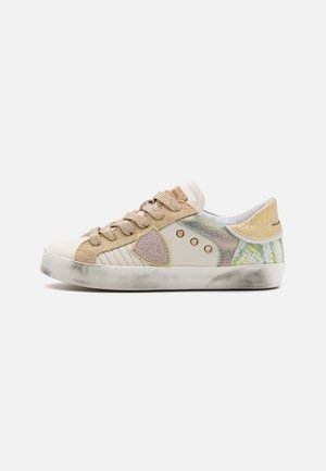 Low-top sneakers featuring a mix of beige, gold, and pastel colors. Made from leather and textured materials, with a rubber sole and unique accents.