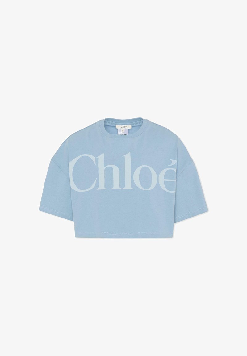 Jasnoniebieska krótka koszulka wykonana z bawełny, z dużym białym logo "Chloé" na przodzie. Krótkie rękawy i okrągły dekolt.