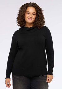 Maglione nero con ampio scollo a cowl e maniche lunghe. Presenta dettagli con bottoni sui polsi. Realizzato in un morbido materiale lavorato a maglia.