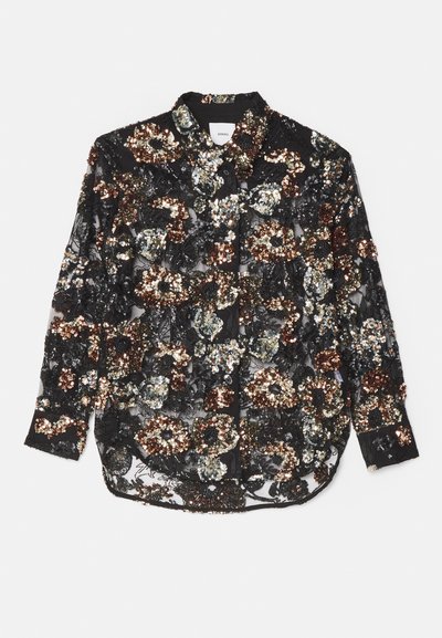 Chemisier noir transparent orné de paillettes multicolores avec des motifs floraux ; il présente un col pointu et une fermeture à boutons sur le devant.