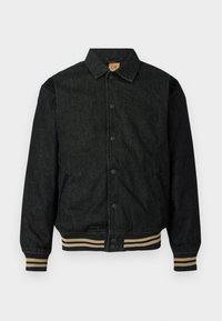 Svart denimjakke med knappestolpe foran, ribbede ermer og elastisk midje. Har krage og sidelommer.