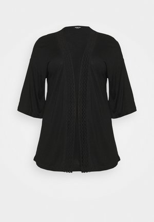 Zwarte open cardigan met driekwart mouwen en een getextureerde verticale rand langs de voorste randen.