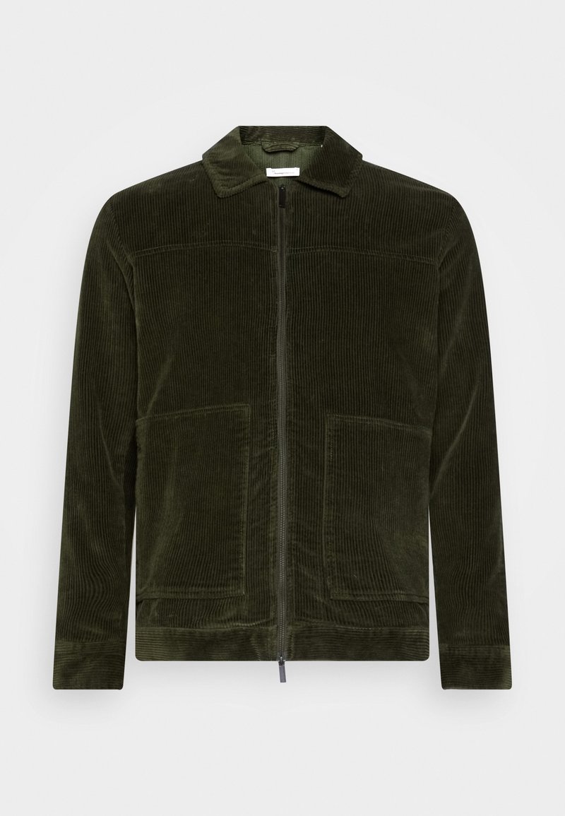 Veste en velours côtelé vert olive avec fermeture éclair à l'avant, col et deux poches avant. Caractérisée par une texture côtelée et une coupe droite.