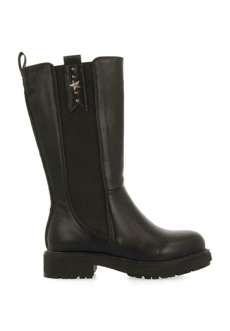 Bota de cuero negra hasta la rodilla con panel elástico, suela texturizada y acento en forma de estrella. Superficie lisa y construcción resistente.