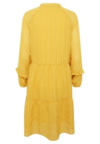 Robe midi jaune à rayures, manches longues bouffantes, ourlet à volants, coupe décontractée, faite en tissu léger.